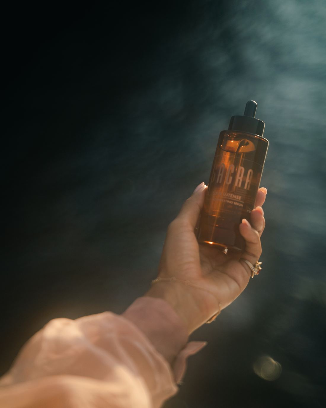The oil warms between your palms