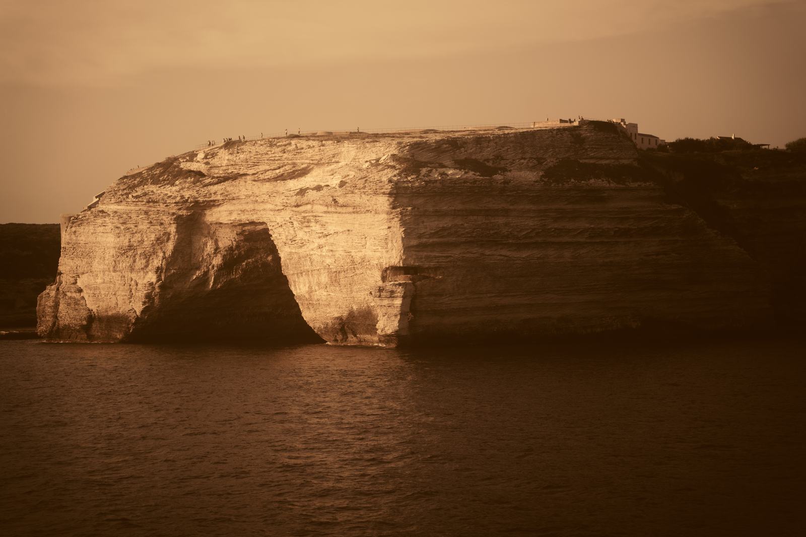 Limestone cliffs above the sea at sunset