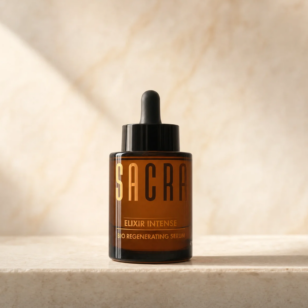 SACRA Elixir Intense Bio Regenerating Serum, amber glass dropper bottle on marble